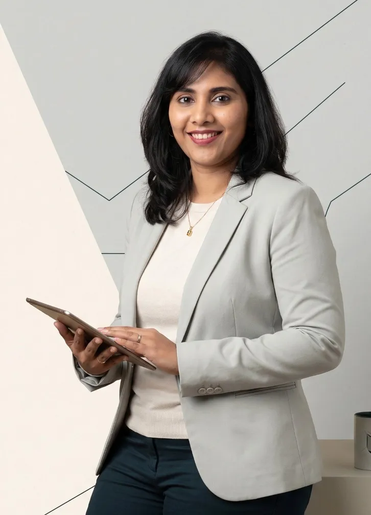 Portrait of Ash Pesala holding a tablet